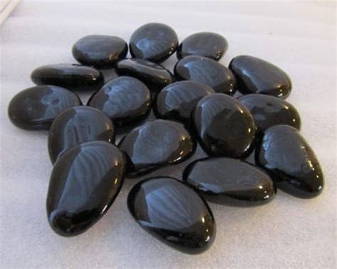 This guide outlines how to use different types of landscaping rocks. Black Glass Pebbles | Midland Stone United Kingdom