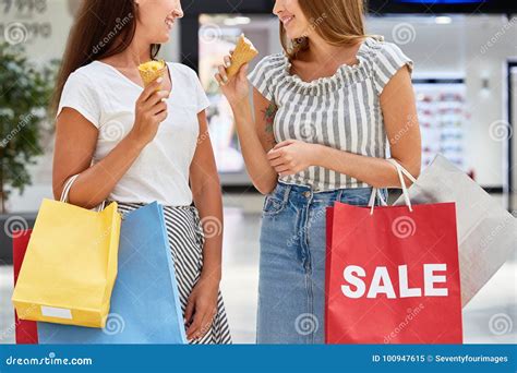 Pretty Girls Shopping In Mall On Sale Stock Image Image Of Cone Shop 100947615