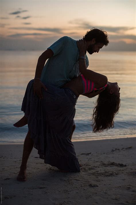 Couple Dancing At The Beach At Sunset By Stocksy Contributor Mosuno