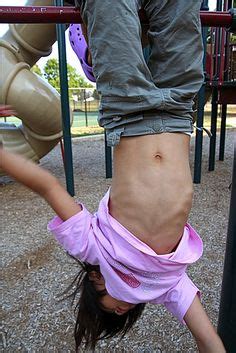 The Hanged Man Image Girl Belly Button Upside Down Monkey Bars Wealthy