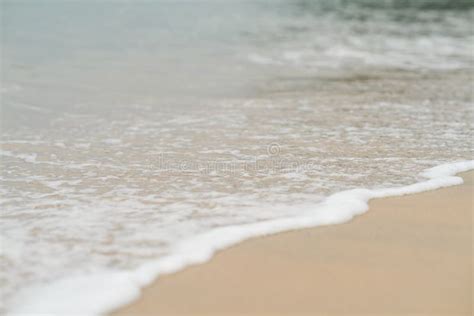 Soft Waves With Foam Of Ocean On The Sandy Beach Background Stock Image