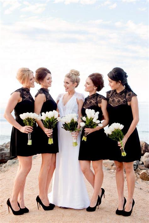 What would your wedding be without fresh flowers? Black and white wedding- bridesmaids in black with white ...
