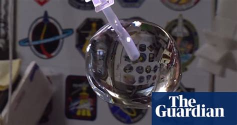 Astronauts Play With Floating Ball Of Water In Space