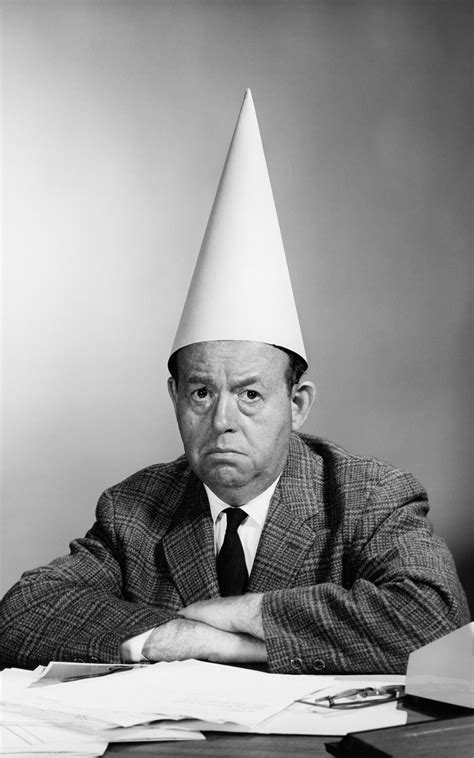 1960s Man Wearing Dunce Cap By Vintage Images Ubicaciondepersonas