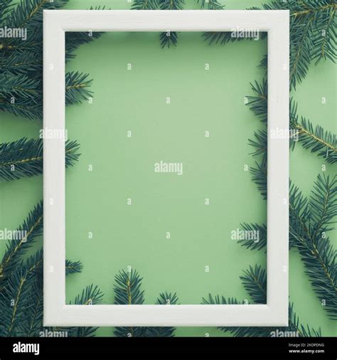 Vertical Christmas Frame With Fir Branches Mint Green Background