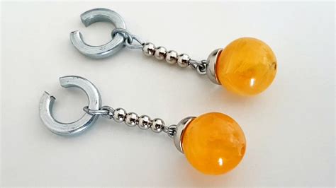 Goku has the power of the dragonballs and can grant wishes like the dragon. Dragon Ball Super Potara Earrings