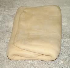 An Uncooked Pizza Dough On The Floor
