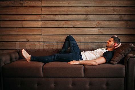 Young Happy Man Lying On Couch Relaxation On Sofa Stock Image Colourbox