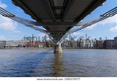 Underneath Millennium Bridge Looking Across River Stock Photo