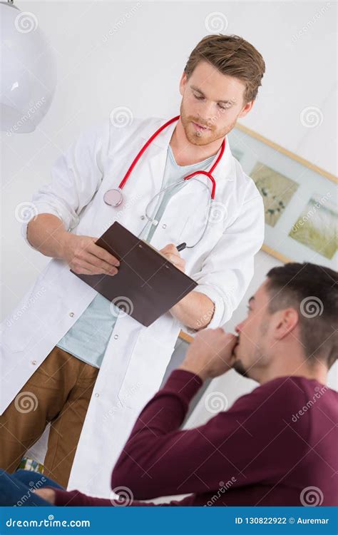Doctor Questioning Young Male Patient Stock Photo Image Of Symptoms