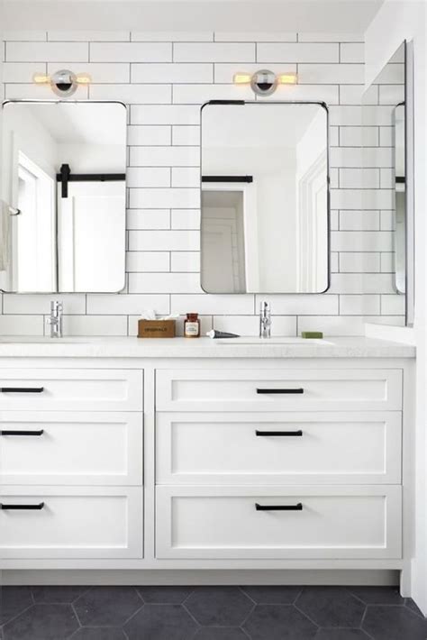 Farmhouse white shaker cabinets with black hardware. The Boys Bathroom Inspiration