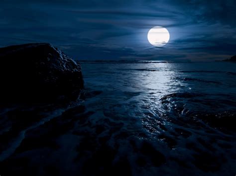 Premium Photo Night Time Over The Ocean With Rock And Full Moon