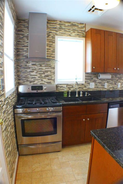 Space is just enough to angle the tiles into place. Tile backsplash up to ceiling for continuity. # ...