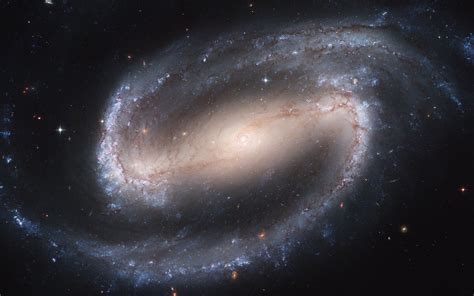 It is considered a grand design spiral galaxy and is classified as sb(s)b. Galaxia Espiral Barrada 2608 - Astronomia e Universo ...