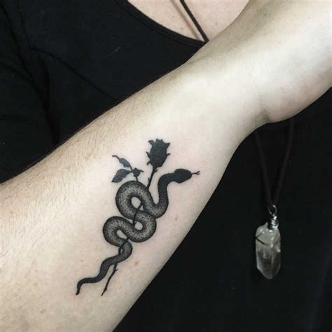 Rose tattoo meaning it's perfectly valid to pick a tattoo on a whim, but choosing one with a personal meaning adds another reason to sit through the discomfort of a long inking session. Small snake and rose tattoo - Tattoogrid.net