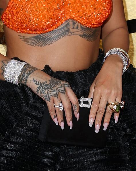Rihanna S Sternum Tattoo Rihanna S Tattoos And Meanings Popsugar Beauty Photo 12