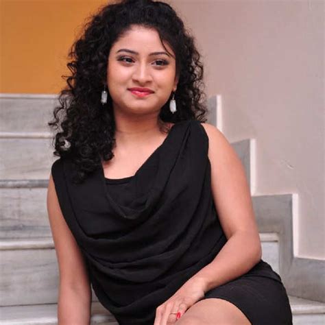 Vishnu Priya Sizzles In A Black Dress While She Poses During A Photoshoot