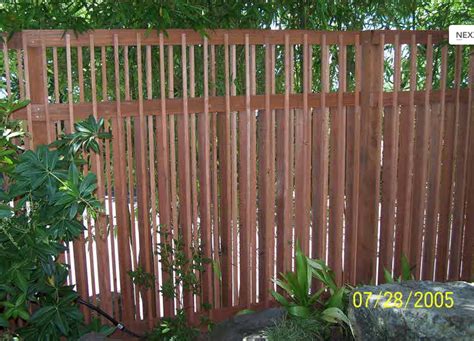 Control of shutters, which are linked slats that swing out/in to covering an opening or may be tilted to partially cover an opening, such as indoor or exterior window shutters. fence-vertical-slats-redwood-4 - Neighborhood Nursery