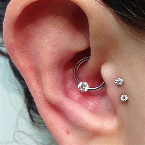 Girl Showing Her Surface Double Tragus Piercing