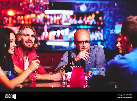 Friendly People With Drinks Spending Time In The Bar Stock Photo Alamy