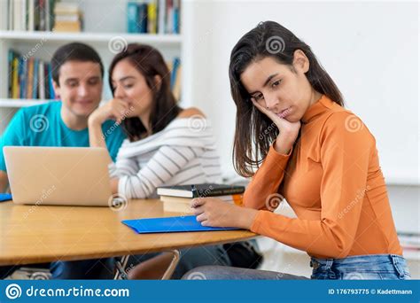 Lonely Young Adult Woman With Group Of Students Stock Image Image Of