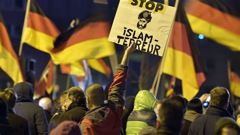 A Protester In Germany Holds A Banner Reading Stop Islam Terror