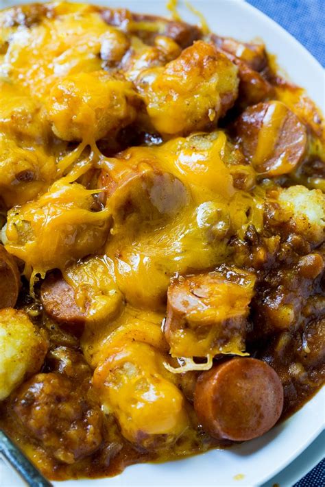 Sliced hot dogs, chili, tater tots, and cheddar cheese combine to make an easy and delicious meal. Cheesy Hot Dog Tater Tot Casserole - Spicy Southern Kitchen