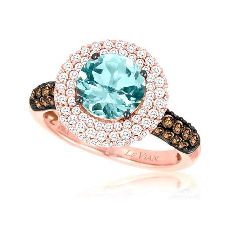 Neon Blue Paraiba Tourmalines Set In A Strawberry Gold Design With