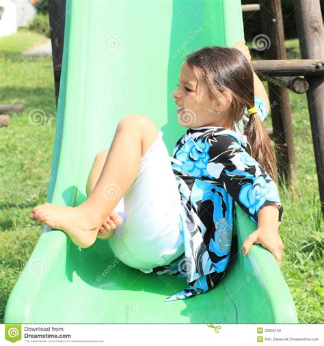 Grinning Girl On A Slide Royalty Free Stock Images Image 32855149