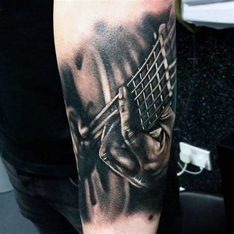 There are also a few black inked music notes in the middle. 100 Music Tattoos For Men - Manly Designs With Harmony