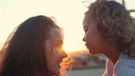Portrait Of Happy Mother And Little Daughter Over Sunset Stock Video