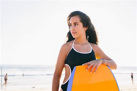 Cute Teen Girl With A Bodyboard At The Beach By Victor Torres Surfer