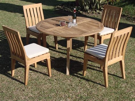 Choose from patio sets with or without cushions, or tables that seat four or eight people. 5-Piece Outdoor Teak Patio Dining Set: 52" Round Table, 4 ...