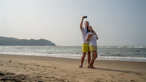 Happy Couple Taking Selfies Near Sea Loving Couple Embracing During