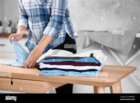 Woman Folding Laundry Folding Clothes Hi Res Stock Photography And