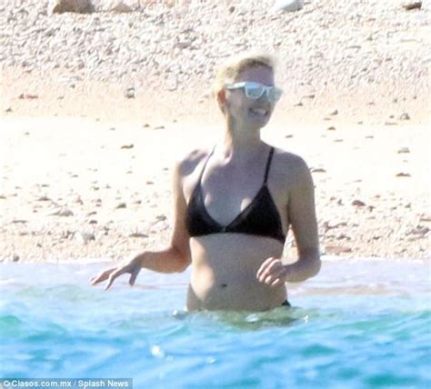 Charlize Theron Shows Off Her Toned Figure In A Black Bikini In Cabo