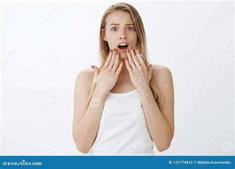Waist Up Shot Of Concerned And Shocked Worried Young Girl With Blond