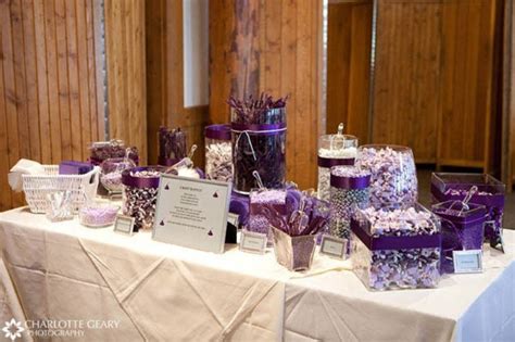 Get the best deals on wedding table decorations. Picture Of an ivory and purple candy table with various ...