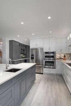 Discover inspiration for your kitchen remodel or upgrade with ideas for storage, organization, layout and decor. Grey plank tile, dark cabinets, light countertops for kitchen | New house | Pinterest | Grey ...