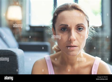 Unhappy Mature Woman Staring At Camera Stock Photo Alamy