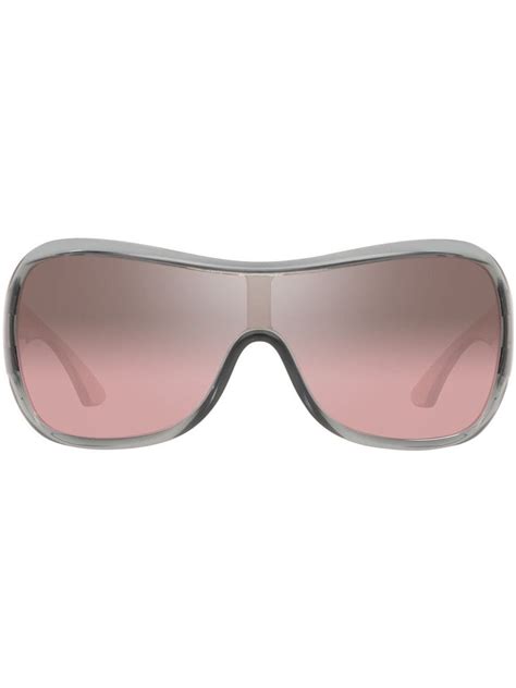 a pair of sunglasses with pink tinted lenses on the top and bottom half of it
