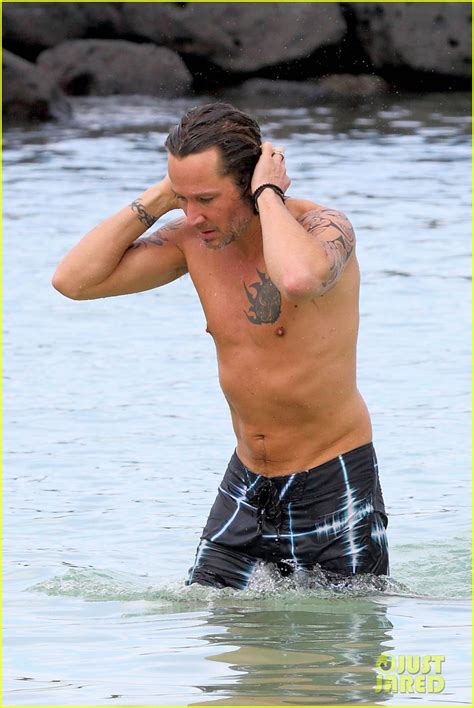 Keith Urban Puts His Shirtless Body On Display While Getting Wet In The