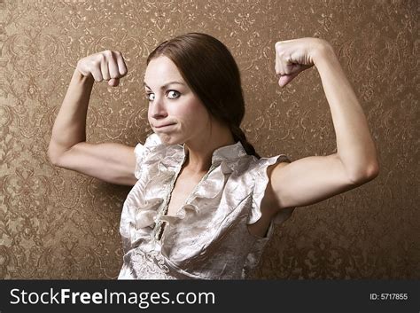 Young Woman Flexing Her Biceps Free Stock Images And Photos 5717855