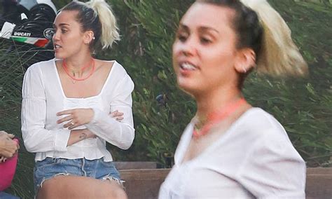 Miley Cyrus Flashes Her Legs In Cutoffs As She Skips Vmas Daily Mail