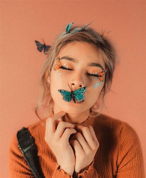 A Woman With Butterflies Painted On Her Face