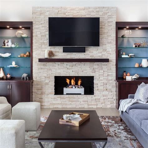Stacked Stone Fireplace Design With Shelves On Both Sides Tv Over