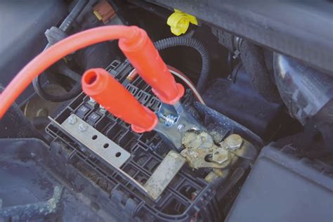 It's a good idea to buy a set of jumper cables and keep attach one of the red clips to the positive terminal of your battery. How to jump start and bump start a car - Confused.com