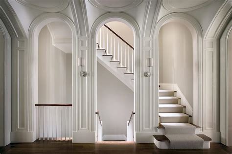 Lots of people over 6 feet tall constantly bump their head in japan because they're not used to having to duck when they go through a doorway. Arched Staircase Doorway with Sconces - Transitional ...