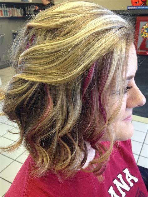 Choose your favorite vibrant haircolor and ask your stylist to add peekaboo pieces to your brunette hair. Long bob with curls. Pink peek a boo highlights. Salon A ...