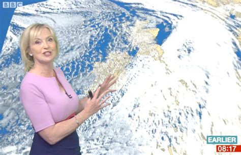 Carol Kirkwood Highlights Ample Assets In Curve Hugging Lilac Dress